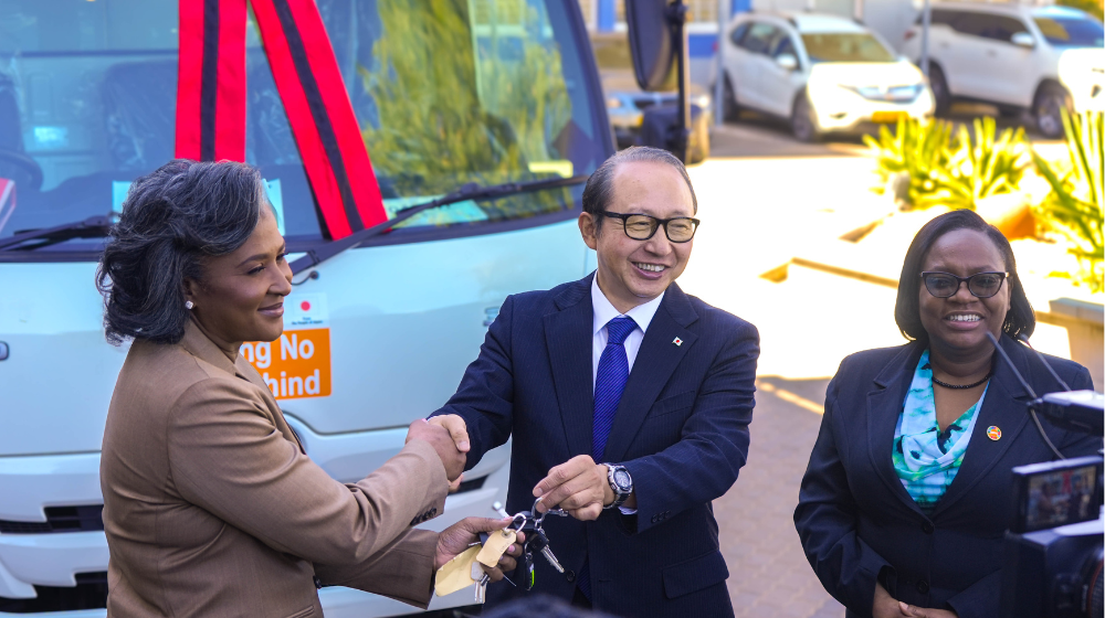 Former First Lady of Namibia, Mrs. Monica Geingos, receives a mobile health van donated by H.E. Mr. Hisao Nishimaki, Ambassador of Japan to Namibia, as UNFPA Namibia Representative Ms. Erika Goldson looks on.