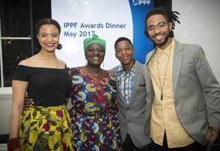 3)	H.E. Adv. Gawanas with her daughter Amakhoe, son Sinan and grandson Hodago at the award ceremony. 