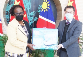 UNFPA Namibia Representative, Sheila Roseau received the sewing machine donation from the Embassy’s Chargé d' Affaires, Mr. Yang