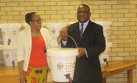 Dr. Kalumbi Shangula, Health Minister, receiving the donation of hygiene kits from UNFPA Representative.