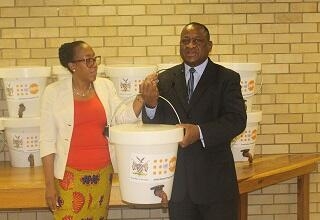 Dr. Kalumbi Shangula, Health Minister, receiving the donation of hygiene kits from UNFPA Representative.