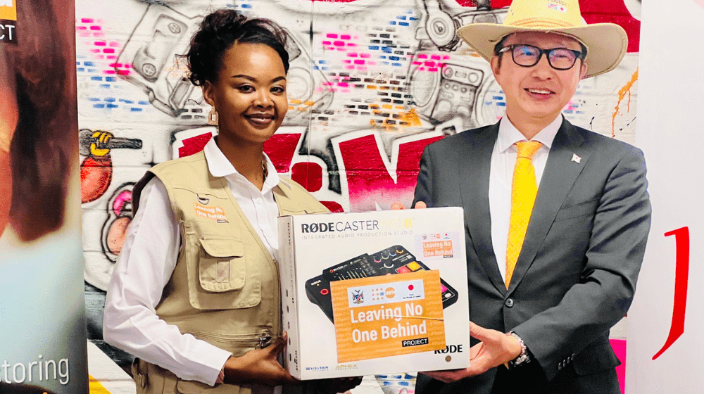 Focus FM Station Commander Chruschey Snyders receiving the donation from H.E. Ambassador Hisao Nishimaki on behalf of Focus FM. 