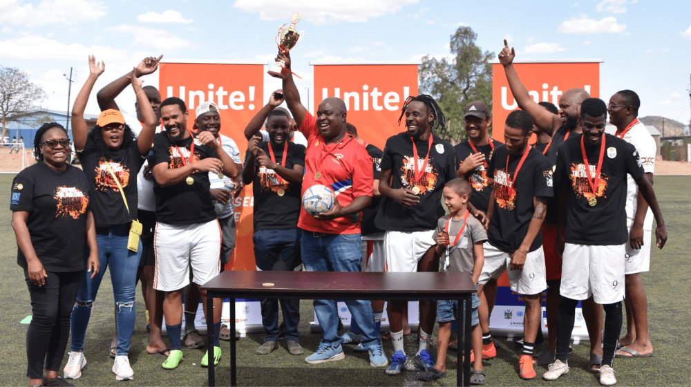 The Namibia Media Team celebrates their victory after winning the penalty shootout in the exciting final of the 7-a-side soccer tournament, raising awareness for the #16DaysOfActivism2024 campaign.