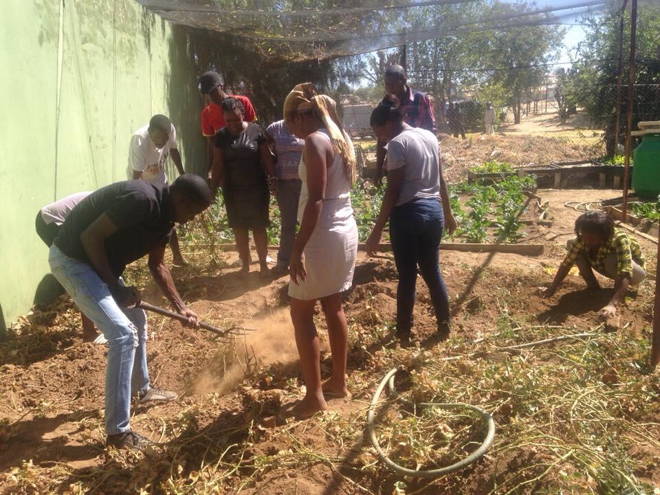 Young people prepare soil for planting at the Windhoek Multi-purpose Youth Resources Centre.