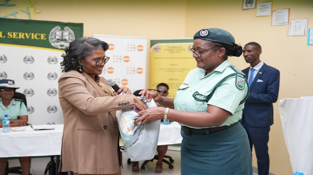 The First Lady presents the dignity kits' contents. 