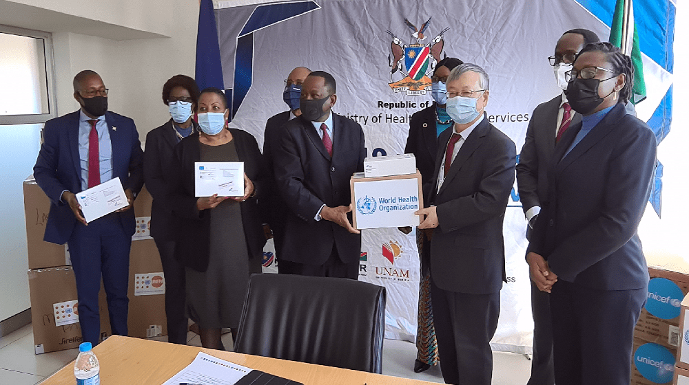 Mr. Sen Pang, UN Resident Coordinator, hands over PPE donation to health minister, Dr. Kalumbi Shangula on behalf of UN Namibia.