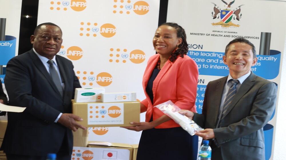 Health minister Hon. Dr Kalumbi Shangula receiving the donation for reproductive health commodities from UNFPA Namibia Officer i